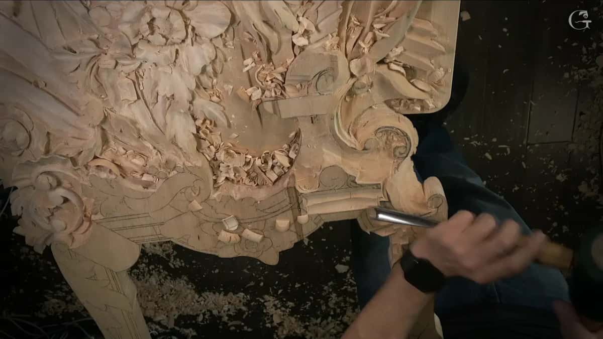 Gouge pushed in beside a carved scroll