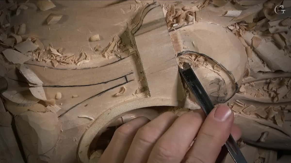 A narrow gouge sinks into the drawn circle