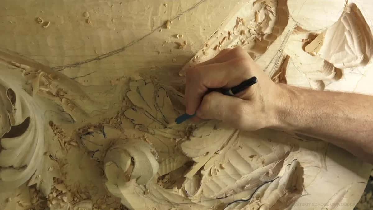 A pencil line going onto a roughed leaf, chips all around it