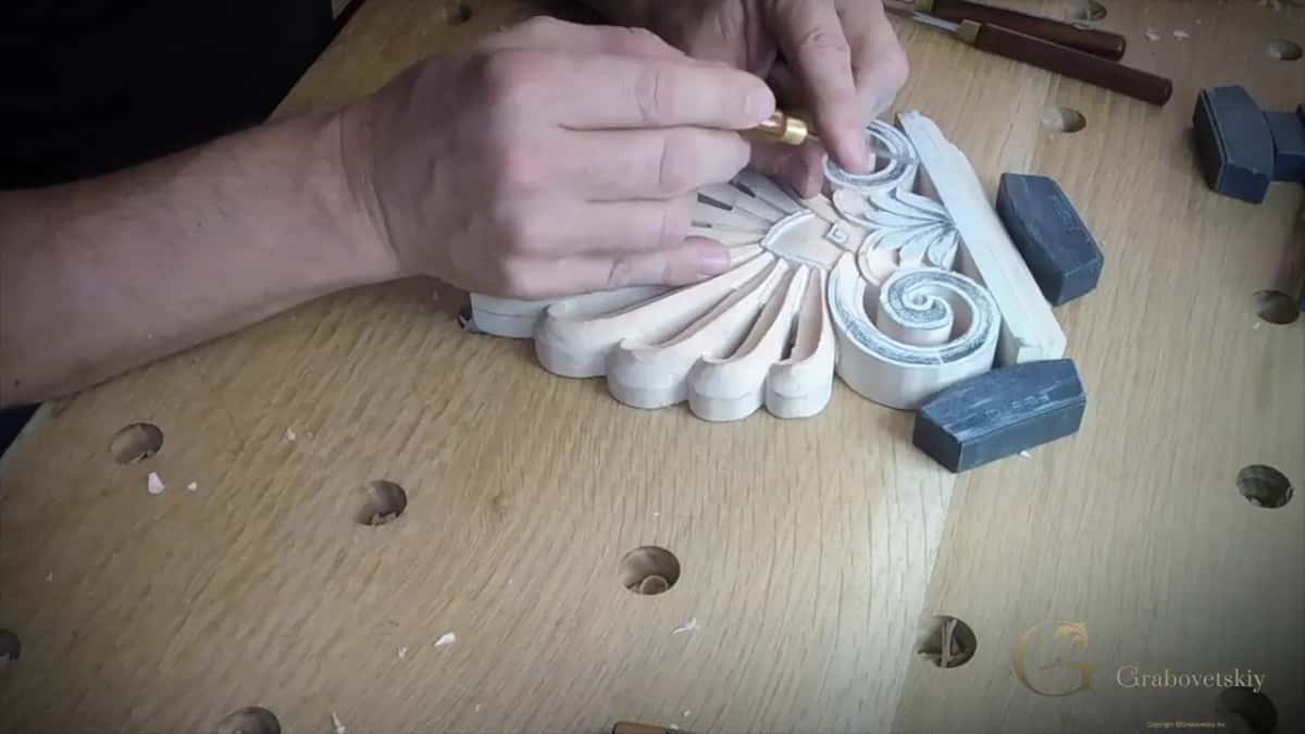 Fist wrapped around a micro tool with a brass ferrule, cleaning at the center of the big fan