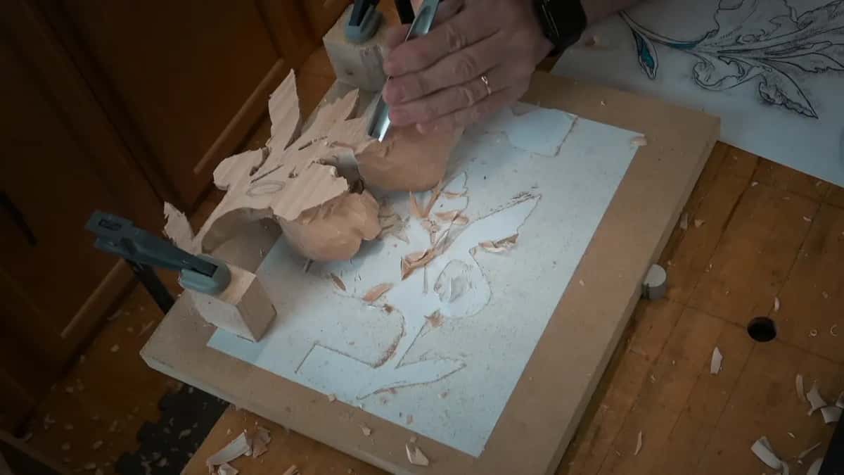 Face down now, a clamp at one end