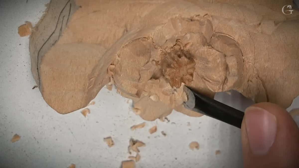 A flatter tool works the lower right petal