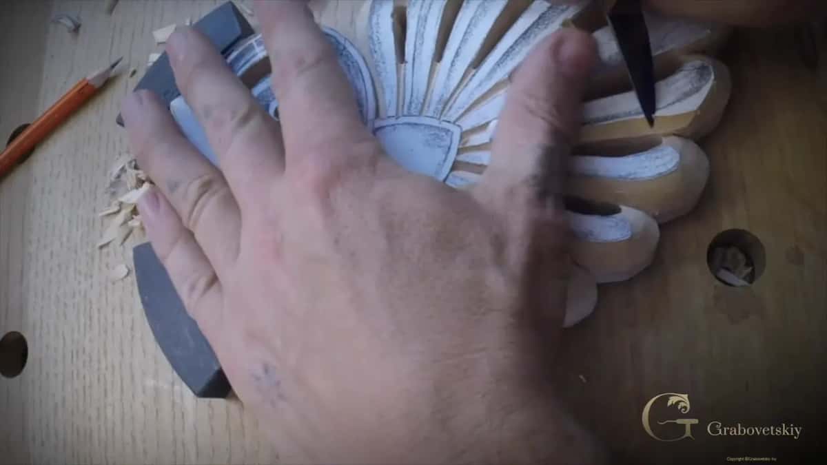 Knife tip at a petal edge