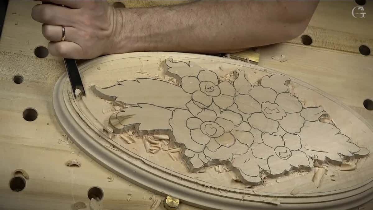 Grooving round inside the molding line, with the whole oval and its flowers in view