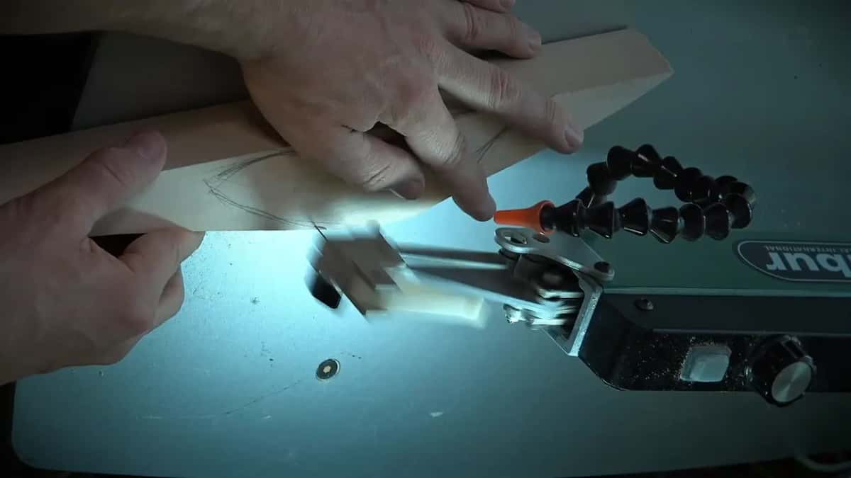 A board turned under a bright lamp