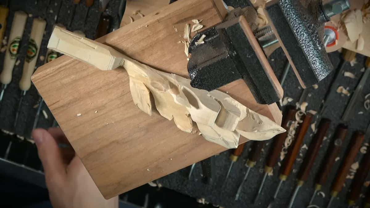 Tool rack beside a clamped carving