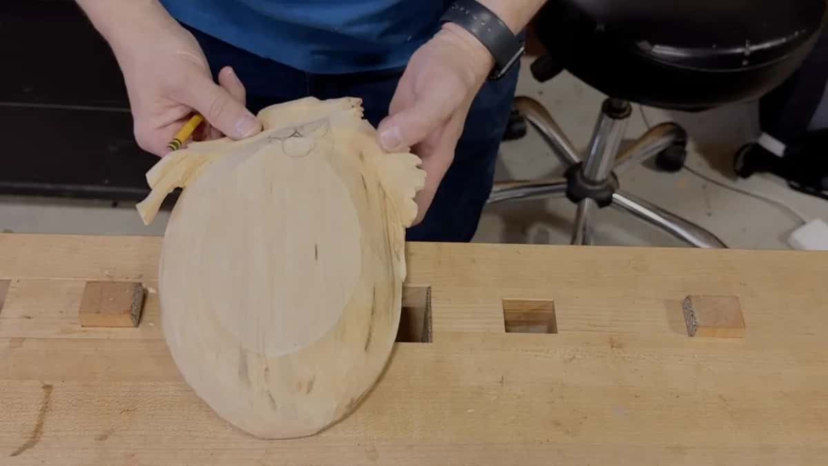A yellow pencil marks the leaf end of the bare underside while the tray tilts up off the bench