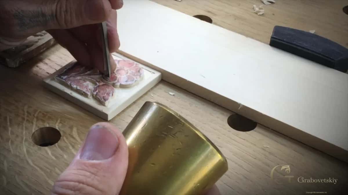 Mallet and gouge Brass mallet behind a gouge