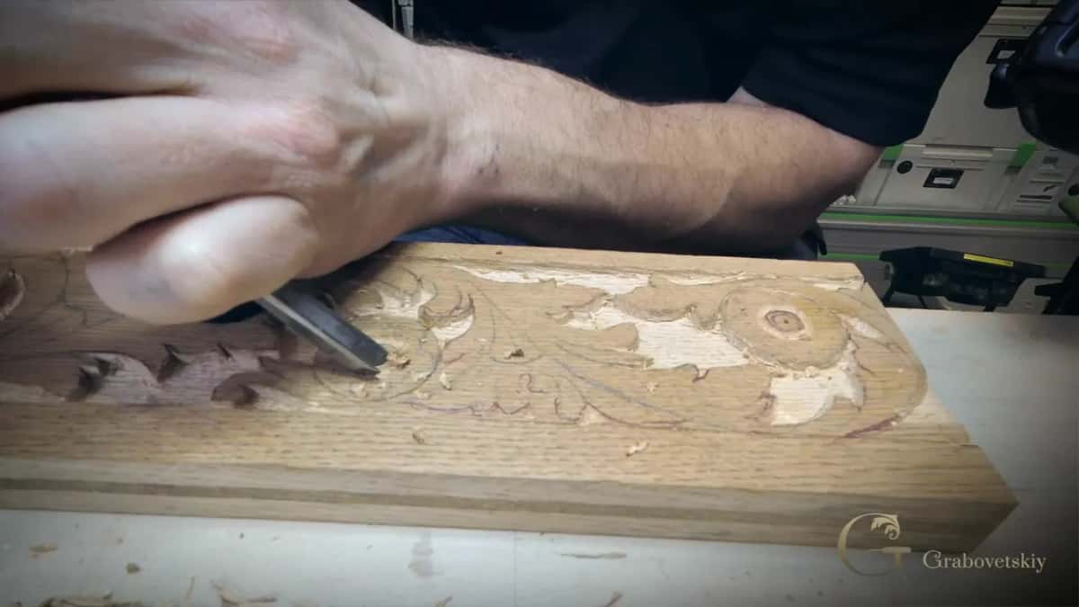 Palm tool gripped in a fist on an apron board