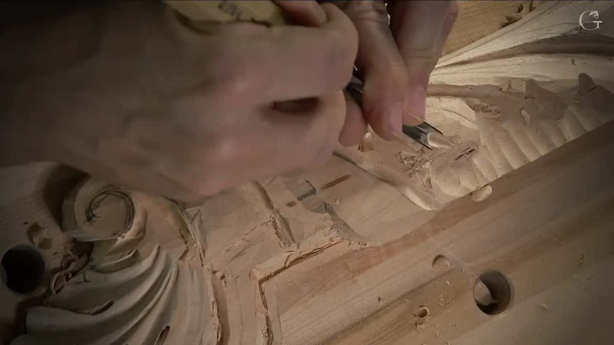 Knuckles bunched over the handle, the blade in the leaf