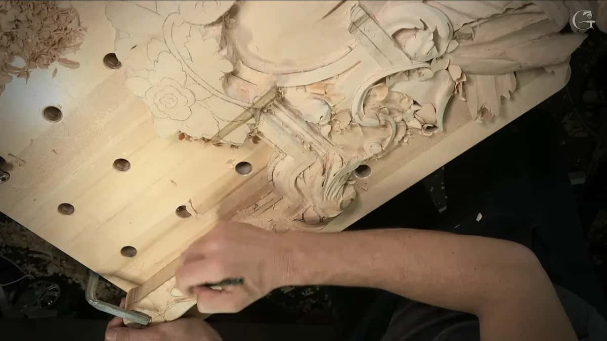 An arm reaches across to the lower band