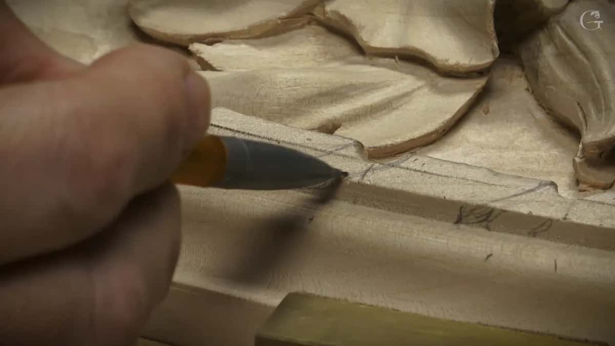 A yellow pencil draws a curved line down the face of the molding
