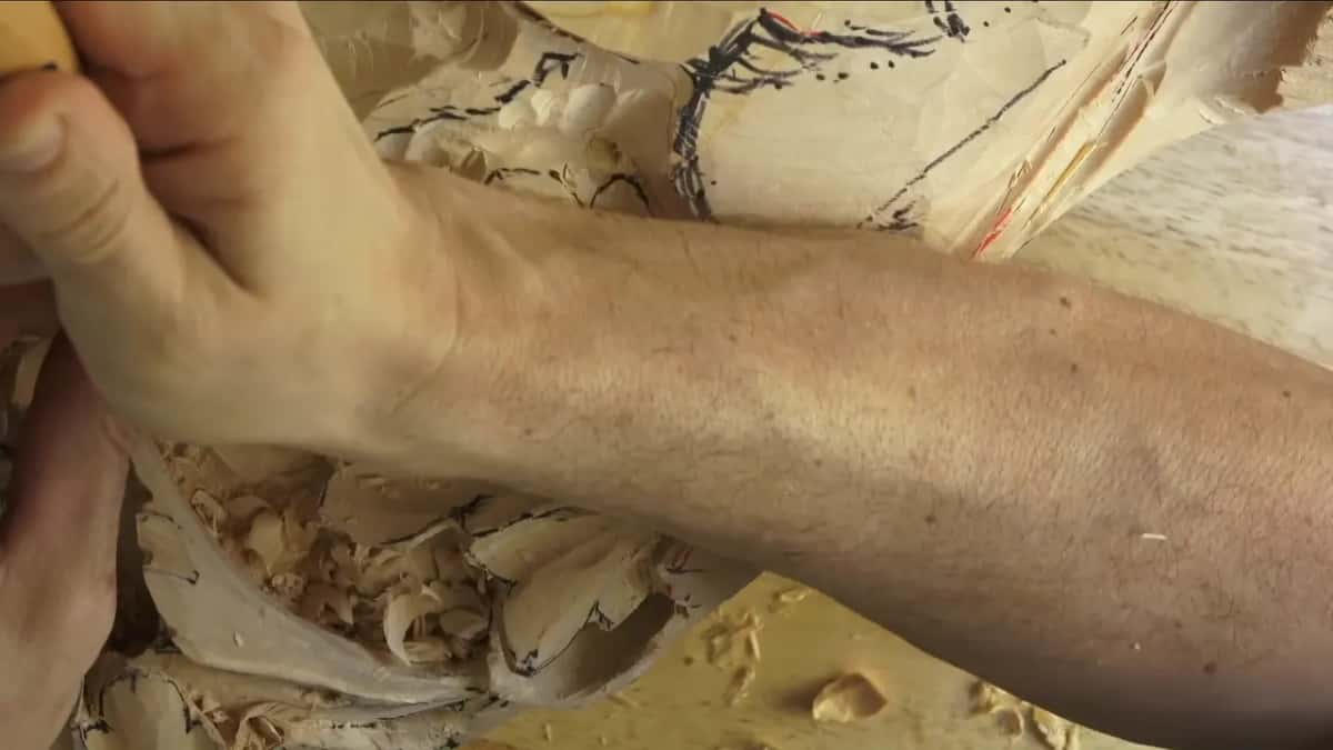 Forearm and fist on the handle