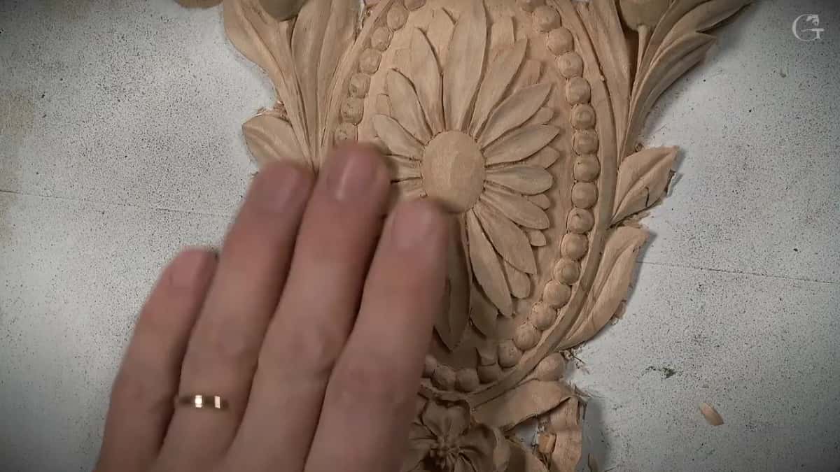 Fingertips beside the sanded dome
